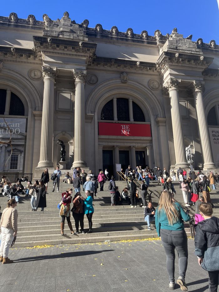 Visitors on the steps of the Metropolitan Museum of Art in autumn