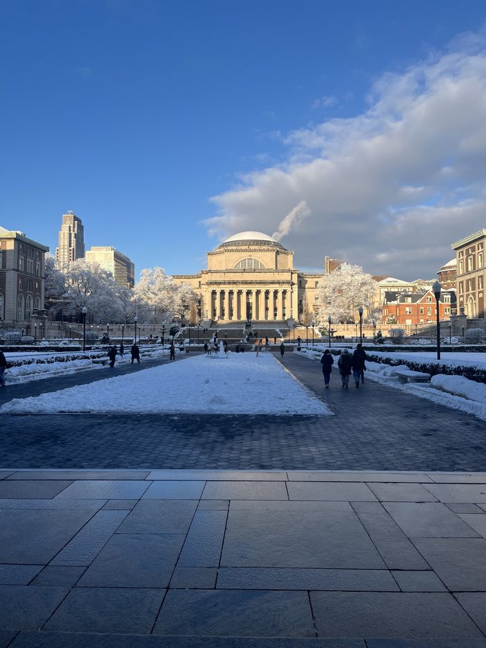 Low Library and the surrounding campus under snow on a clear winter morning